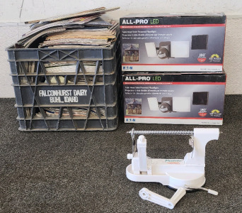 (2) All Pro LED Twin Head Solar, Powered Floodlights, Peelota Apple Peeler, And A Crate of Magazines!