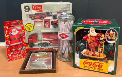 (1) Coca-Cola Santa Clayse Mechanical Bank (1) Coca-Cola Straw Dispenser (1) Coca-Cola 9 Piece Steel Truck Set & More