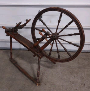 An Antique Spinning Wheel, likely from the 1800s