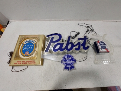 (3 - Signs) Pabst Extra Light Beer (14.5"H x 12.25"W), Large Pabst Blue Ribbon (17"W x 22"H), Mug Shaped Pabst Blue Ribbon (11"W x 15.5"H), All Lighted Signs