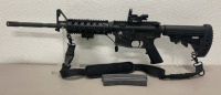 Bushmaster XM15-E2S Model 5.56 NATO Caliber, Semi Automatic Rifle W/ Tacticon Flashlight, CV Life Optical, And Shoulder Strap