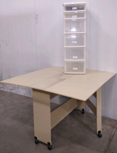 (1) 4'x 4'x 30&frac12;" Rolling Folding Leaf White Sewing Table & (1) 12&frac12;"x 16"x 40&frac12;" White 5-Drawer Plastic Storage Container/Organizer