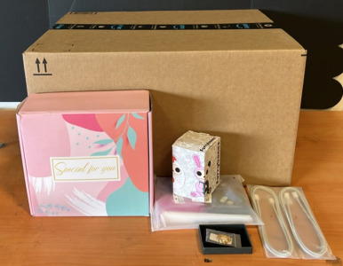 (1) Mothers Day Gift Box (1) Furry Bones Collectible (2) 6&rsquo; USB-C to USB-C Charger & An Amazon Returns Box