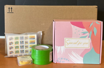 (1) Mothers Day Gift Box (1) Three Pack of 1&rdquo; Wide Green Masking Tape (1) Four Pack Pocket Pharmacy Pill Holders & An Amazon Returns Box