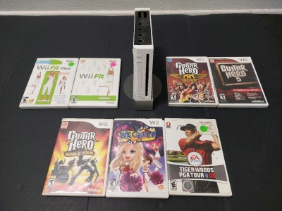 Nintendo Wii System (No Cables), Wii Fit, Wii Fit Plus, Guitar Hero World Tour, Guitar Hero 5, Guitar Hero Aerosmith (Empty Case), Tiger Woods PGA Tour '08, We Cheer