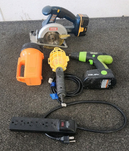 Ryobi P501 5-1/2" 18V ONE+ Cordless Circular Saw, Kawasaki 19.2V Cordless Drill, Incandescent Trouble Light, Lumilite 4700 Krypton Flashlight, And An Extension Cord.
