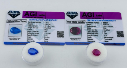 (2) Certified Natural Gemstones With COA&rsquo;s (1) 5.55ct. Pink Oval Cut Rubellite Tourmaline (1) 5.95ct. Pear Cut Blue Topaz