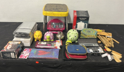 (1) Foot Stool (1) Brand New Sunshade (1) Poly Hot spot (1) Toenail Painting Kit (1) Star Wars Terry Brooks Cassettes (4) Collectible Coin Banks & more