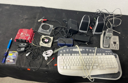 (2) Keyboards (1) Set of Philips Speakers (1) Landline Phone (1) Battery Output (1) 5 Lazer LED (1) Motorola Flip Phone (1) Computer Part