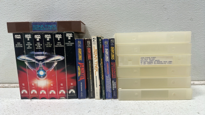 (6) Collection of Vintage Star Trek VHS Tapes - Movie I-VI, (1) Star Trek IV: The Voyage Home VHS Tape, (6) Various Star Trek Books, (6) Clear Plastic VHS Storage Cases
