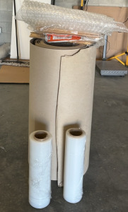 (2) Rolls of Plastic Wrap (1) 38&rdquo; Wide Roll of Ram Board (2) UHaul Paper Pads & More