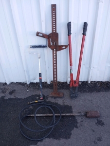 1) Hi-Lift Jack, 1) Blow Torch Head, 1) 36" Pittsburg Bolt Cutter and 1) Extendable Paint Roller