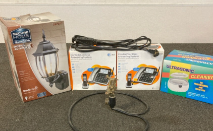 Secure Home Motion Activated Porch light, 2 AT&T cord cordless answering system, Rotating sprinkler head and an ultrasonic cleaner