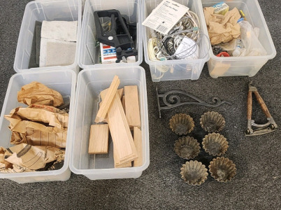 (6) Small Totes Filled With Drawer Handles, Cords, Wood Pieces, Vintage Muffin Tins, And More.