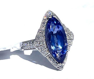 4.48ct. Marquis Modified Cut And Faceted Tanzanite Zoisite And 0.42ct. Round Cut And Faceted Diamonds In Platinum Ring, Size 7 W/ GGA C.O.A. ( $18,970.00 Retail Value)