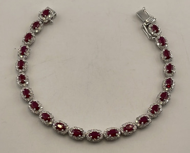 Platinum 7.31ct. Oval Brilliant Cut Ruby & 2.94ct. Round Brilliant Cut Diamond Bracelet W/ AIGL C.O.A. ( $28,732.00 Retail Value)