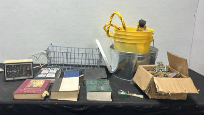 (1) Bucket w/ Tow Straps (1) Bucket (1) Storage Basket (6) Books (1) Lock w/ Key (1) Vintage Clock/ Radio (1) Box of Unknown Metal Items