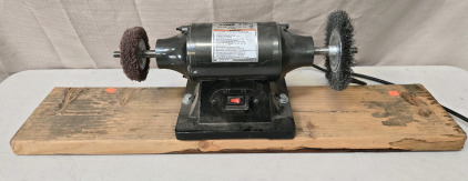 Central Machinery 6-inch Buffer On Plank Of Wood