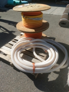 2) Spools Conduit 1" Plastic Cutoff Unknown Footage, and Small Section Plastic Conduit 1.5"
