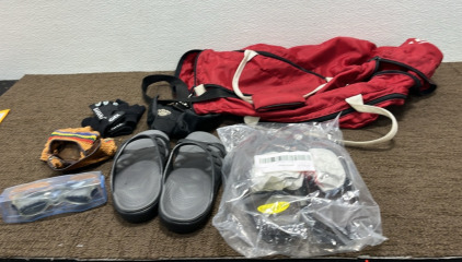(1) T Gym Bag (2) Pairs of Slippers (3) Pairs of Fingerless Work Gloves (1) Pair of Goggles (1) Blue Collapsable Crate