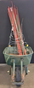 Garden Supplies, Including A Wheelbarrow, Tomatoes Cages, And Poles for Climbing plants