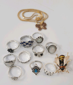 Various Rings Sized 6-10, A Honey Bee Broach, And Butterfly Necklace.