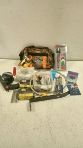 (1) Buck Knives Bag Brand New, (1) Hunting Stabilizer, (1) Compass, (1) Lock, Assorted Screws and Nails, and more.