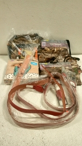 (1) Buck knives bag, (1) skull beach towel, (2) cinch backpacks, (4) red leather belts