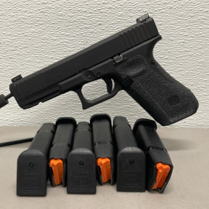 Glock 17 9mm Semi-Automatic Handgun, Includes Case, Holster, Four magazines