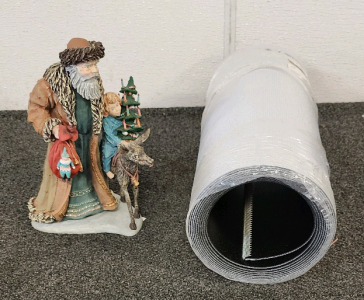Roll Of Conveyor Belting And A Christmas Figurine
