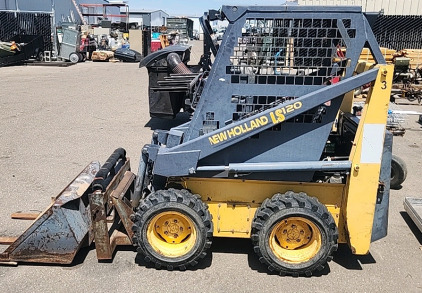 New Holland LS120 Skid Steer With Forks And Small Bucket..