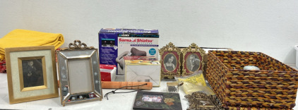 (1) Samurai Shiatsu Kneading Massager (1) Cr&egrave;me Brule Set (1) Tire Knocker (4) Picture Frames (1) Box of Brand New Hangars Assorted Home Decor