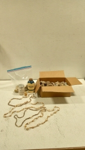 (1) Box of Rocks, (1) Jar of Sand, (1) Jar of Shells, (1) Gold Leaf Bottle, (4) Shell Necklaces, (1) Bag of Rocks and Shells