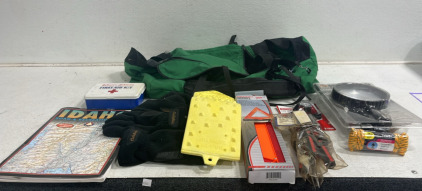 (1) Duffel Bag (1) 12 Volt Handheld Spotlight (1) Emergency Warning Tri-angle (1) Set of Cabelas gloves & Beanie (1) Idaho Map (1) First Aid Kit