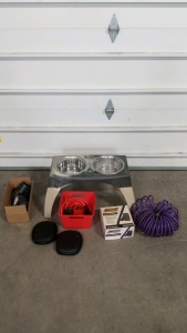 (1) Dog Tall Water and Food Stand With Bowls, (1) Box of Bird Calls, (2) Pairs of Jabra Headphones, (1) Spray Oil into Barrel Kit, (1) Purple Water Hose, (1) Sprinkler Supplies Box