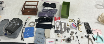 (1) Blood Pressure Monitor (1) Pair of Sunglasses Glass Wipes (1) Lock (2) Ear Plugs (1) Wooden Jewlery Box