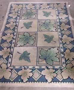 A 94"x 66" Squared Leaf Pattern Rug