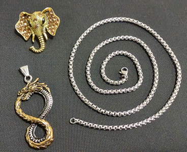 A 25&frac12;" Box Chain Link Necklace, A 2&frac34;" Gold/Silver Toned Dragon Infinite Pendent, & A Gold Toned Crystal Elephant Pin