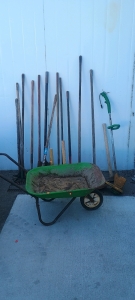 (14) Yard Tools & Wheelbarrow - (1) Green Wheelbarrow (2) Garden Rakes (6) Shovels (1) Turf King Edger (2) Sledgehammers (5) Misc Handles & Tools