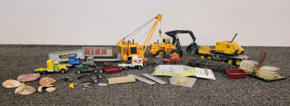 Great Condition Diecast JOAL MINIATURAS No. 224 Caterlillar 591 Pipelayer, Joal Diecast Model Of A Volvo BM L160 High Lift Grapple Loader, Lionel 6828-100 P&H Truck Crane, And Other Dicast Model Trucks
