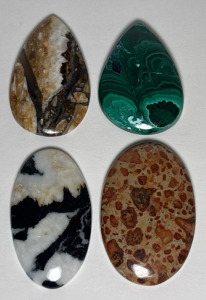 (4) Beautiful Natural Polised Cabochons Including, Astroid Jasper, White Buffalo Turquoise, Gree Malachite, And Wild Horse Jasper