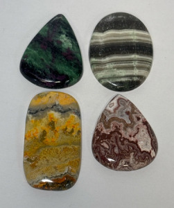 (4) Beautiful Cut Polished Gemstones Including Ruby In Fuchsite, Bumblebee Jasper, Natura Zebra Jasper, And Peach Posita Jasper