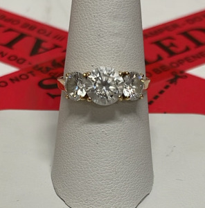 Gold Three-Stone Ring with Round Cut Stones