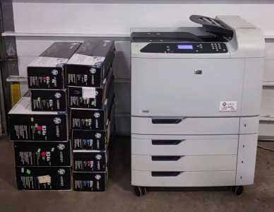 A HP Color LaserJet CP6015xh ID#B4376 w/ (11) Boxes of LaserJet Ink (Assorted Colors)