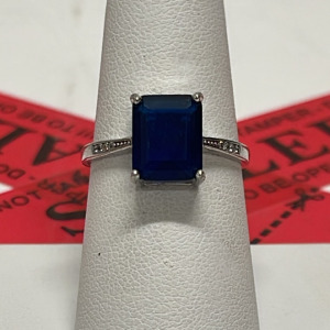 Sterling Silver Ring with Blue Emerald Cut Stone and Accent Stones