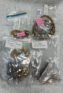 (1) Bag of Tie Clips (1) Bag of Costume Jewlery (2) Bags of Gold Chains