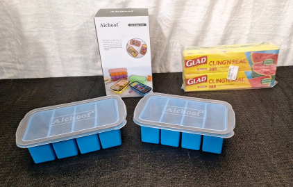 (1) 2-Pack Of Aichoof Large Ice Cube / Freezer Trays W/Lids, (2) 300-SqFt Rolls Of GLAD Cling-N-Seal Food Wrap & (1) Box Of Assorted Amazon Overstock