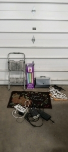 (1) Doormat, (1) Stepladder, (1) Loom, (1) File Folder, (1) Pile of Hangers, (3) Extension Cords