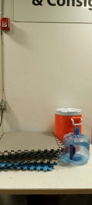 (1) Set of Connectable Squishy Floor Tiles, (1) Orange Water Cooler, (1) Blue Water Jug