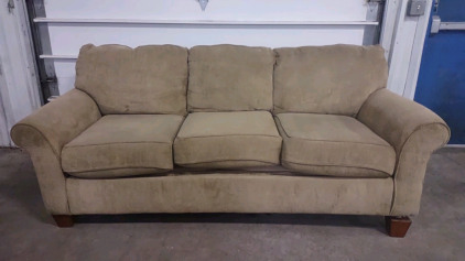 A 3-Seater Tan/Beige Colored Soft Seat Couch